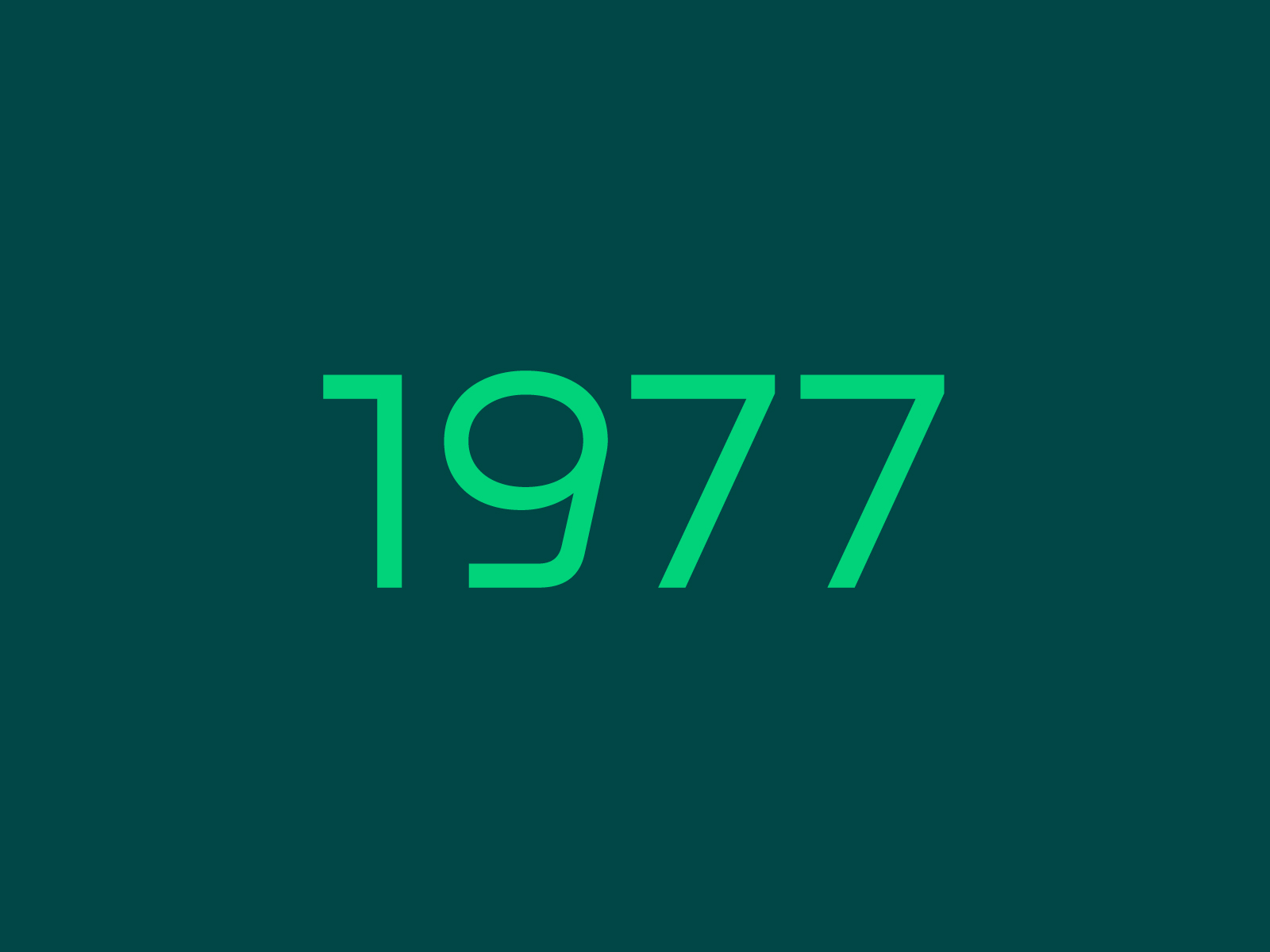 The images shows a dark green tiled image with the year 1977